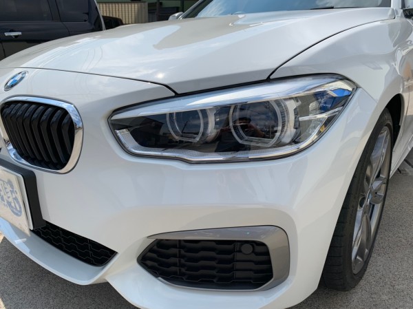 ヘッドライトにプロテクションフィルムを施工した BMW 1シリーズ